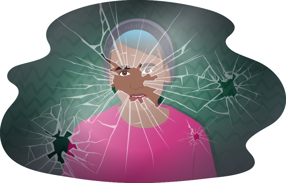 Teen standing behind a shattered glass window