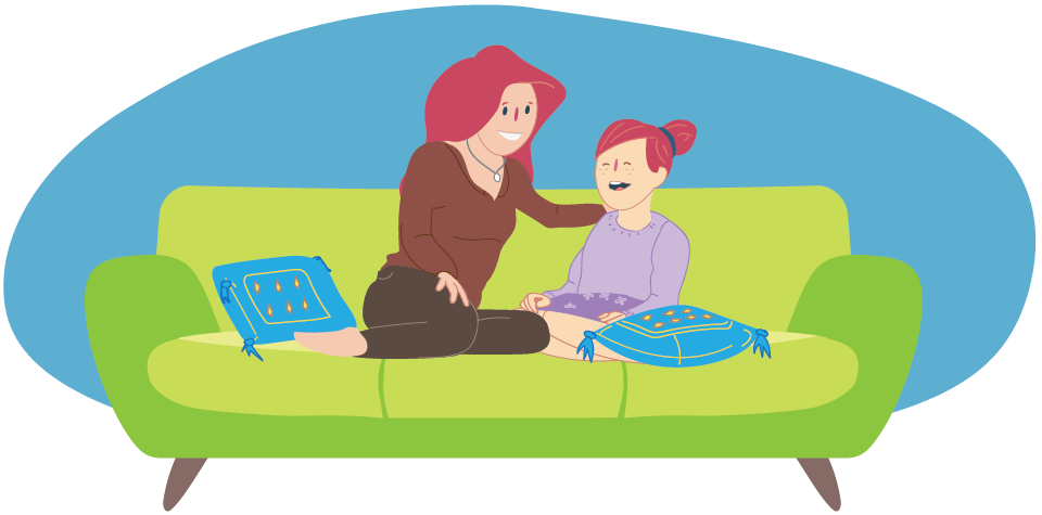 Girl and parent sitting together on couch and talking